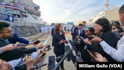 U. S. Vice President Kamala Harris speaks with reporters after visiting the USS Howard naval destroyer at Yokosuka Naval Base outside Tokyo, Sept. 28, 2022.