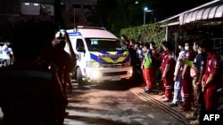 An ambulance carrying victims' coffins arrives at a hospital morgue in Udon Thani, Thailand, Oct. 6, 2022, following a mass shooting at a child care center by a former police officer. At least 38 people, including 24 children, were killed. 