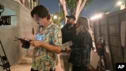 FILE - Jorge Xolalpa, 33, a Mexican-born filmmaker, foreground, directs his latest movie in San Pedro, Calif., Oct. 12, 2022. Xolalpa is among hundreds of thousands of people waiting to learn if the program known as Deferred Action for Childhood Arrivals will be allowed to continue.