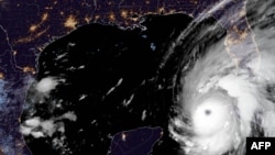 This National Oceanic and Atmospheric Administration (NOAA) satellite handout image shows tropical Hurricane Ian over Cuba, Sept. 27, 2022 at 11:51 UTC. (Photo by Handout / NOAA/GOES / AFP)