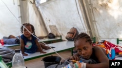 FILE - Children showing symptoms of cholera receive treatment at a clinic run by Doctors Without Borders in Cité Soleil, Oct. 07, 2022.