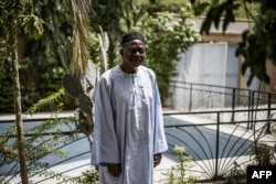 FILE - Longtime Chadian politician Saleh Kebzabo poses after an interview with AFP at his residence in N'djamena, Apr. 12, 2021.