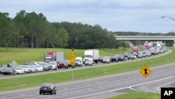 Eastbound traffic crowds Interstate 4 as people evacuate in preparation for Hurricane Ian approaches the western side of the state, Sept. 27, 2022, in Lake Alfred, Fla. 