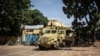 A military vehicle is seen in front of Burkina Faso national television, In Ouagadougou on Oct. 1, 2022.