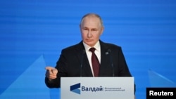 Russian President Vladimir Putin delivers a speech at the 20th annual meeting of the Valdai Discussion Club in Sochi, Russia, on Oct. 5, 2023. Putin said that Russia might revoke its ratification of a nuclear-test ban.