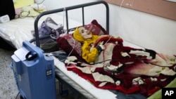FILE - A 10-year-old Palestinian boy, Yazan al-Kafarna, who was born with cerebral palsy, lies at a hospital in Rafah, Gaza Strip, March 3, 2024. Yazan died due to what his doctor said was extreme muscle wastage caused primarily by a lack of food.