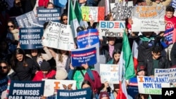 A crowd gathered in front of the White House urging President Biden to expand work permits for long-term immigrants on Nov. 14, 2023. (Joy Asico/AP Images for ABIC Action)