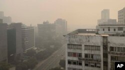 Buildings are seen enveloped by smog and haze in New Delhi, India, Nov. 4, 2022.