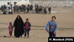 Camp officials say IS families continue to arrive at the Haj Ali camp daily fearing retribution attacks, keeping the camp filled despite the fact that many families that fled IS are going home, Dec. 27, 2017. 