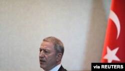 FILE - Turkish Defense Minister Hulusi Akar speaks during an interview in Ankara, Turkey, Oct. 23, 2019.