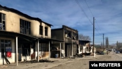 A view shows buildings burned during a series of clashes in Masanchi village in Zhambyl province, Kazakhstan, Feb. 8, 2020. 