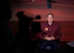 FILE - NASA Administrator Jim Bridenstine talks to multiple media outlets at NASA's Jet Propulsion Laboratory in Pasadena, California, Nov. 26, 2018.