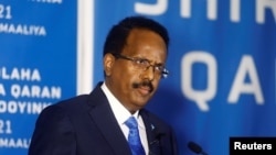FILE - Somalia's President Mohamed Abdullahi Mohamed addresses delegates at the Somali election negotiation in Mogadishu, Somalia, May 27, 2021.