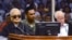 In this photo released by the Extraordinary Chambers in the Courts of Cambodia, the two most senior surviving members of the Khmer Rouge regime Nuon Chea, left, and Khieu Samphan listen to the verdict which upheld their life sentences in Cambodia's top court, Phnom Penh, Cambodia, Nov. 23, 2016.