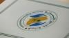 FILE - A folder with a logo of the Human Rights Commission of Saudi Arabia is pictured on a desk during the Universal Periodic Review of Saudi Arabia by the Human Rights Council at the United Nations Office in Geneva, Switzerland.