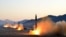 FILE - Undated photo released by North Korea's Korean Central News Agency via KNS on March 7, 2017, shows the launch of four ballistic missiles by the Korean People's Army during a military drill at an undisclosed location in North Korea.
