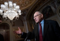 FILE - Alan Dershowitz, a Harvard law professor, speaks to reporters at the Capitol in Washington, Jan. 29, 2020.