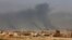 Smoke rises after an airstrike by U.S.-led coalition warplanes during fighting on the western side of Mosul, Iraq, Feb. 27. 2017. A senior Iraqi police commander said Monday that troops have taken control of the western side of a key bridge in Mosu.