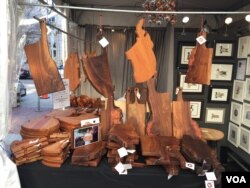 Master woodworker Jeffrey Oh uses a variety of wood from all corners of the U.S. to make everything from coffee tables to cheese boards. (J.Taboh/VOA)