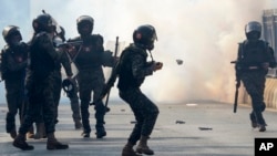 Paramilitary soldiers fire tear gas shells to disperse supporters of imprisoned former Prime Minister Imran Khan's Pakistan Tehreek-e-Insaf party, during clashes in Islamabad, Pakistan on Nov. 26, 2024.