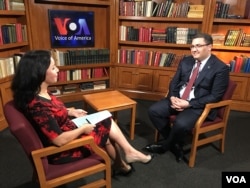 Uzbekistan's Justice Minister Ruslanbek Davletov talking to Navbahor Imamova, VOA, May 15, 2018