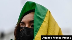 An activist listens to speakers supporting the Ethiopian government during a protest in Washington on Nov. 21, 2021.