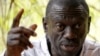 FILE - Opposition leader Kizza Besigye speaks during a news conference at his home at the outskirts of Kampala, Uganda, Feb. 21, 2016.