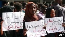 People demonstrate against the way police handled a student protest over a shortage of bread in Darfur's state capital Nyala the previous day, in Khartoum, Sept. 23, 2019.