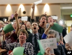 People shout to Rep. Jason Chaffetz during his town hall meeting at Brighton High School in Cottonwood Heights, Utah, Feb. 9, 2017. In an echo of the raucous complaints that confronted Democrats back in 2009 as they worked to pass "Obamacare" in the first place, Republicans who want to repeal it now are facing angry pushback of their own at constituent gatherings from Utah to Michigan to Tennessee and elsewhere, even in solidly Republican districts.