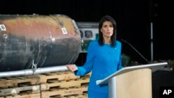 U.S. Ambassador to the U.N. Nikki Haley speaks in front recovered segments of an Iranian rocket during a press briefing at Joint Base Anacostia-Bolling in Washington, Dec. 14, 2017.