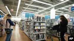 FILE - In this March 25, 2021 file photo, shoppers look at items in Bed, Bath and Beyond, in New York. U.S. consumer prices increase is the biggest increase since 2012.