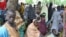 FILE - Refugees fleeing Boko Haram attacks on the town of Bama take shelter at a school in Maiduguri, Nigeria, Sept. 3, 2014.