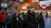 People queue to cast their votes at the polling station during general election in Nuuk, Greenland, March 11, 2025. 