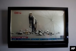 Banksy's work is displayed in the "The Walled Off Hotel" in the West Bank city of Bethlehem, Friday, March 3, 2017.