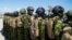 Kenyan police officers arrive at Toussaint Louverture International Airport in Port-au-Prince, Haiti, on Feb. 6, 2025.