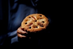 Pajonglak Dardarananda, 51, shows a pastry in her bakery house near Santa Cruz Church, ahead of Pope Francis' visit to Thailand, in Bangkok, Nov. 15, 2019.