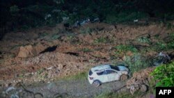 Fotografía publicada por la oficina de prensa del Gobierno de Chocó que muestra el área de un deslizamiento de tierra en la carretera entre Quibdó y Medellín, en Colombia, el 12 de enero de 2024.