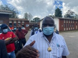 July Moyo, Zimbabwe’s minister of local government, visiting some of the wetlands in Chitungwiza, Zimbabwe, on Jan. 30, 2021. (Columbus Mavhunga/VOA)