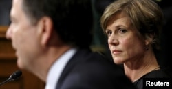 FILE - Then-Deputy Attorney General Sally Quillian Yates (R) listens as FBI Director James Comey speaks during a Senate Judiciary Committee hearing in Washington.
