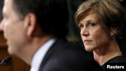 FILE - Then-Deputy Attorney General Sally Quillian Yates (R) listens as FBI Director James Comey speaks during a Senate Judiciary Committee hearing in Washington.