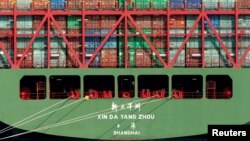 FILE - China Shipping containers sit on a ship in the Port of Los Angeles after being imported to the U.S., California, Oct. 7, 2010. 