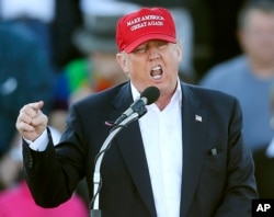 FILE - In this Feb. 28, 2016, file photo, Republican presidential candidate Donald Trump speaks during a rally in Madison, Ala.