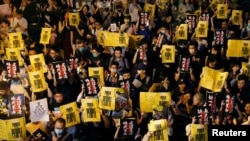 Anti-extradition bill protesters attend a rally calling on the British and U.S. governments to monitor the implementation of "one country two systems" principal, in Hong Kong, China August 16, 2019.