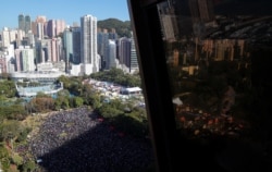 Protesters attend a Human Rights Day march, organized by the Civil Human Right Front, in Hong Kong, Dec. 8, 2019.