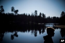 Luhansk native Ivan, 18, who asked his last name to be withheld for fear of persecution for his family, poses for a photo during an interview with the Associated Press in Kyiv, Ukraine, March 28, 2019.