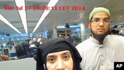 This photo provided by U.S. Customs and Border Protection shows Tashfeen Malik, left, and Syed Farook, who together perpetrated the deadly 2015 attack in San Bernardino, Calif., at Chicago's O'Hare International Airport in 2014.