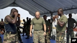 Nigerian navy officers undergo military exercises aboard USS Nashville as US Navy trains partners from around Africa's Gulf of Guinea to help boost maritime security in a region plagued by piracy, drug smuggling and raids on oil facilities, at the Lagos H
