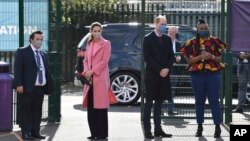 Britain's Prince William with Kate, Duchess of Cambridge visits a secondary school in east London, March 11, 2021 where he defended Britain’s monarchy against accusations of bigotry made by his brother, Prince Harry, and his sister-in-law, Meghan.