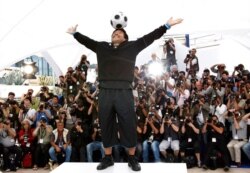 FILE - Former Argentine soccer player Diego Maradona poses during the photo call for the documentary "Maradona" during the 61st International film festival in Cannes, southern France, May 20, 2008.