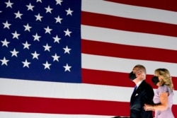 Democratic presidential candidate former Vice President Joe Biden and his wife Jill Biden watch fireworks during the fourth day of the Democratic National Convention, Aug. 20, 2020, at the Chase Center in Wilmington, Del.